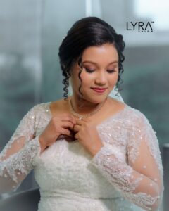 Bridal makeup and hairstyling at Lyra Salon – elegant white gown look with flawless finish